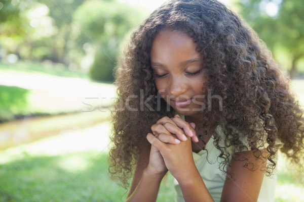 Fiatal lány imádkozik park napos idő fű gyermek Stock fotó © wavebreak_media