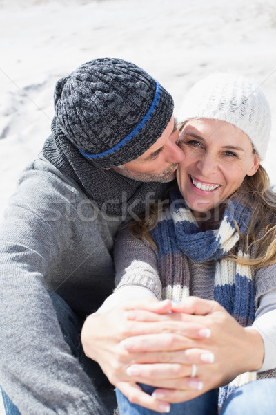 Attractive couple on the beach in warm clothing Stock photo © wavebreak_media