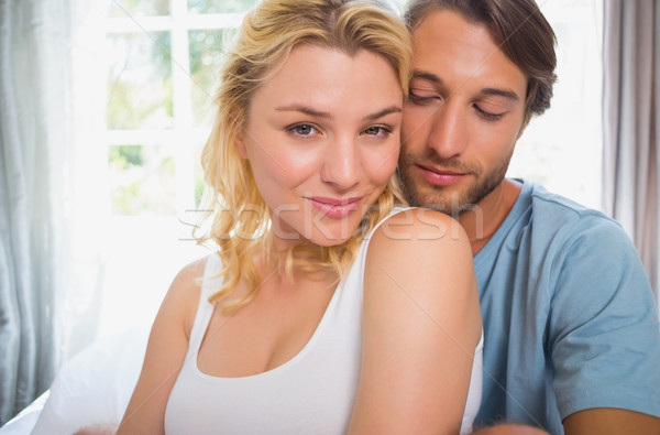 Stock photo: Happy couple relaxing on bed 