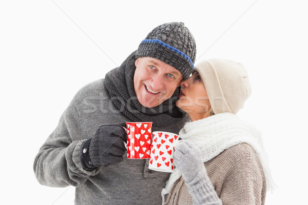 Happy mature couple in winter clothes holding mugs Stock photo © wavebreak_media