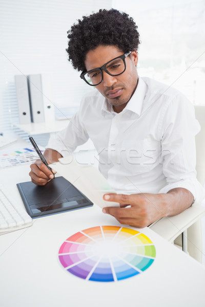 Stock photo: Hipster designer working at his desk