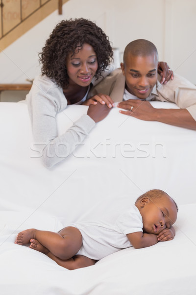 Adorable baby boy sleeping while being watched by parents Stock photo © wavebreak_media