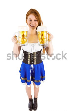 Oktoberfest girl holding jugs of beer Stock photo © wavebreak_media