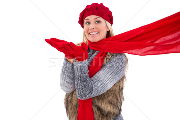 Blonde in winter clothes blowing kiss Stock photo © wavebreak_media