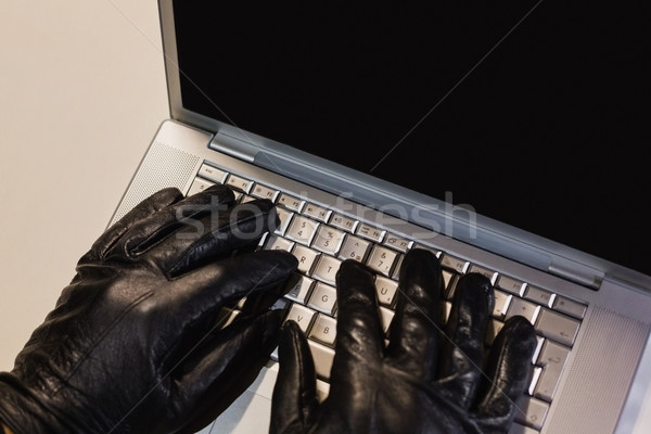 Close up of burglar hacking a laptop  Stock photo © wavebreak_media