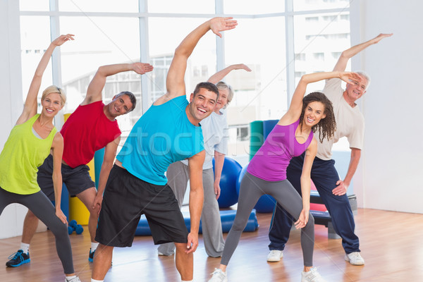 People doing stretching exercise in gym Stock photo © wavebreak_media