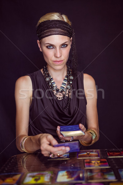 Stock photo: Fortune teller forecasting the future with tarot cards