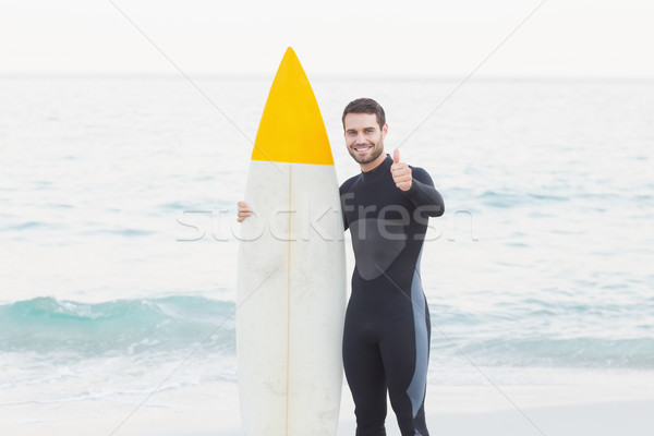 Man in wetsuit on a sunny day Stock photo © wavebreak_media