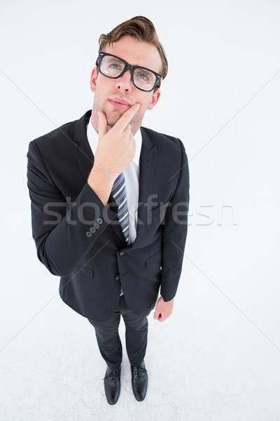 Thoughtful geeky hipster businessman looking up  Stock photo © wavebreak_media