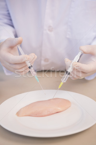 Scientist injecting piece of meat  Stock photo © wavebreak_media