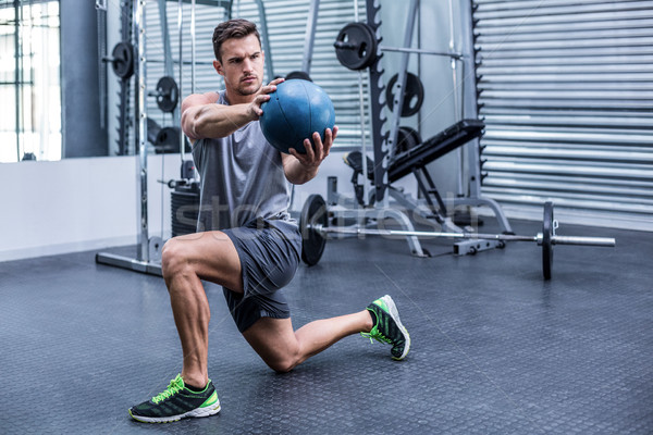 Muscular man doing medecine ball exercises Stock photo © wavebreak_media