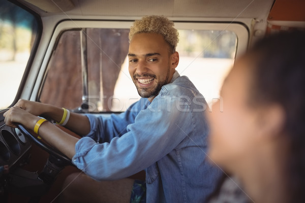 Homme regarder femme conduite van [[stock_photo]] © wavebreak_media