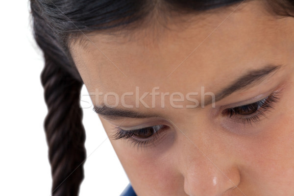 Sad girl looking down against white background Stock photo © wavebreak_media