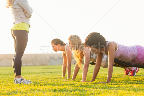 Sporty women doing push ups during fitness class Stock photo © wavebreak_media