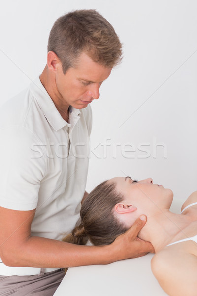 Kobieta szyi masażu medycznych biuro człowiek Zdjęcia stock © wavebreak_media