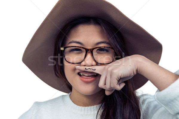 Asian femme moustache doigt posant caméra [[stock_photo]] © wavebreak_media