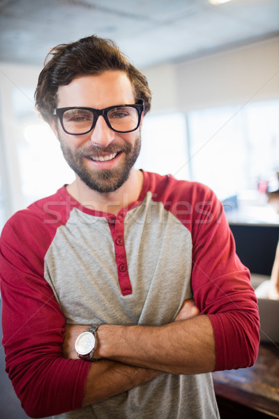 Smiling businessman with arms crossed Stock photo © wavebreak_media
