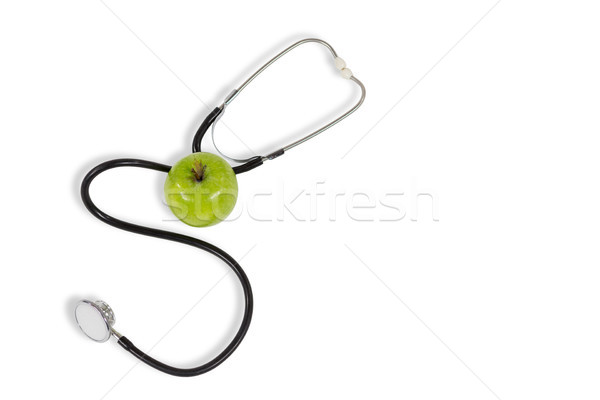 Stethoscope and apple on white background Stock photo © wavebreak_media