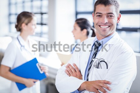 Doctor and nurse discussing over a report Stock photo © wavebreak_media
