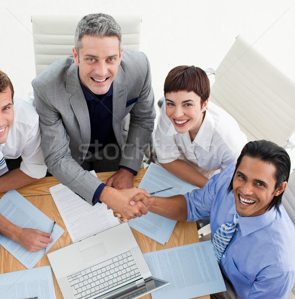 Two smiling business people greeting each other in a meeting Stock photo © wavebreak_media