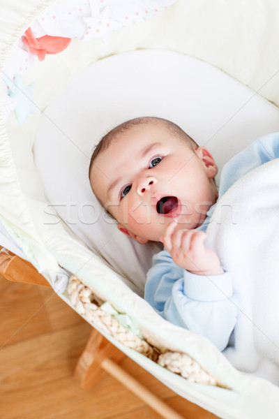 Portrait of a lively baby lying in his cradle Stock photo © wavebreak_media