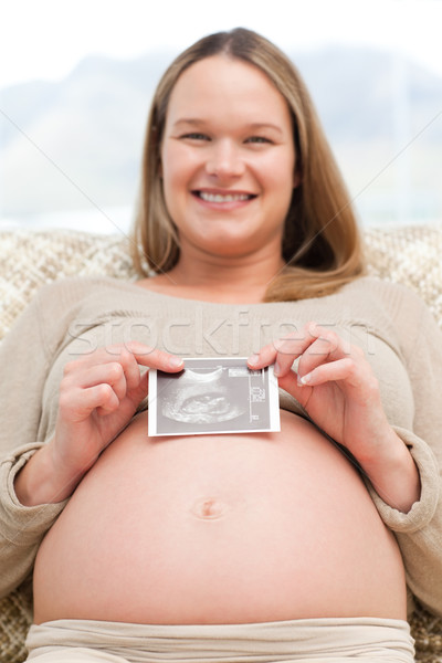 Femme enceinte séance canapé maison [[stock_photo]] © wavebreak_media