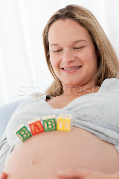 Femme regarder bébé lettres ventre [[stock_photo]] © wavebreak_media