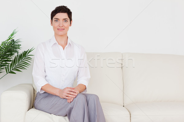 Bella donna seduta divano sala di attesa donna fiore Foto d'archivio © wavebreak_media
