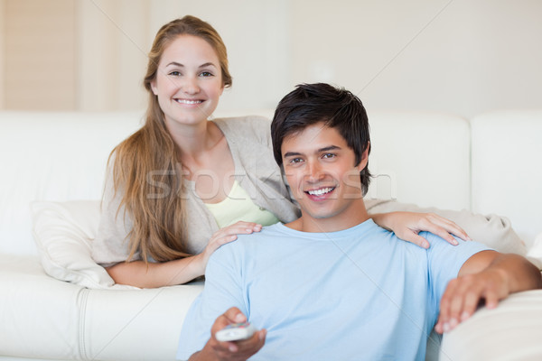 Couple watching television in their living room Stock photo © wavebreak_media