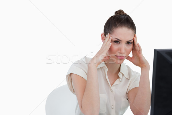 Tired secretary using a computer against a white background Stock photo © wavebreak_media