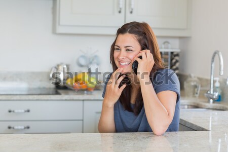 étonné téléphone femme cuisine table outils Homme [[stock_photo]] © wavebreak_media