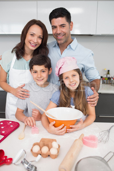 Portrait of family of four preparing cookies in kitchen Stock photo © wavebreak_media