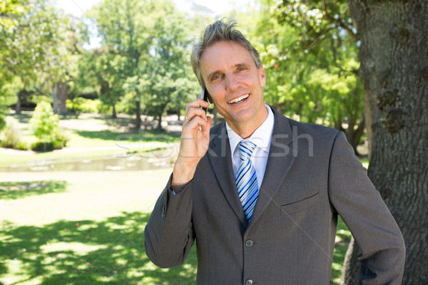 Businessman answering smart phone  Stock photo © wavebreak_media