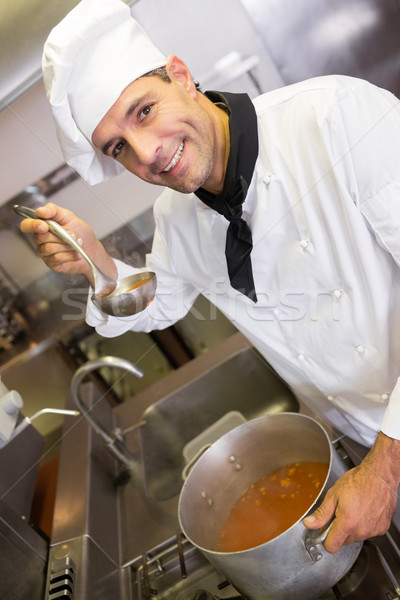 Smiling male chef preparing food in the kitchen Stock photo © wavebreak_media