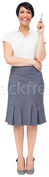 Thoughtful brown haired businesswoman in skirt Stock photo © wavebreak_media