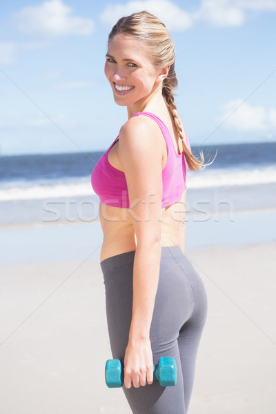 フィット 女性 ダンベル ビーチ 笑みを浮かべて ストックフォト © wavebreak_media