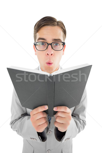 Geeky preacher reading from black bible Stock photo © wavebreak_media