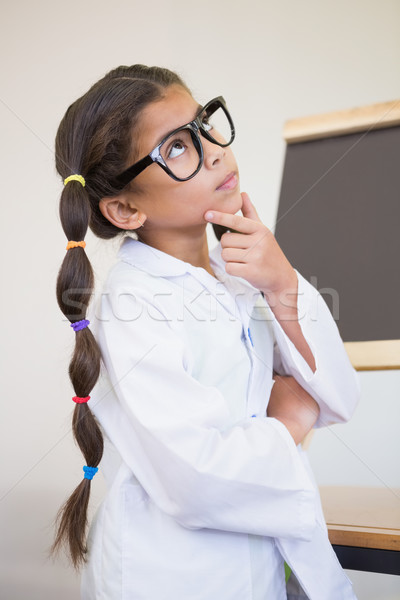 Cute pupil dressed up as scientist in classroom Stock photo © wavebreak_media