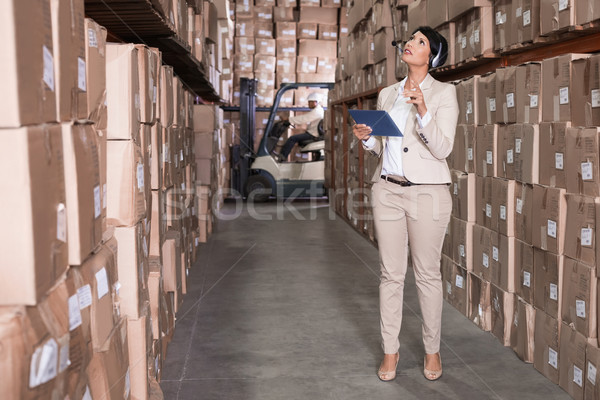 Pretty warehouse manager using tablet pc Stock photo © wavebreak_media