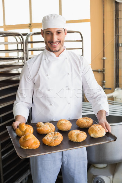 Foto stock: Baker · bandeja · cocina · panadería