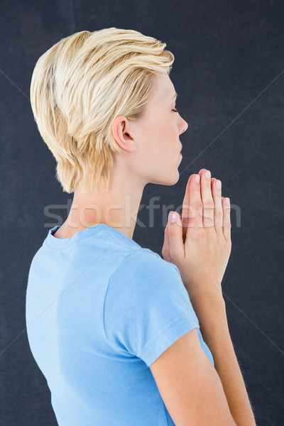 Pretty blond woman praying Stock photo © wavebreak_media