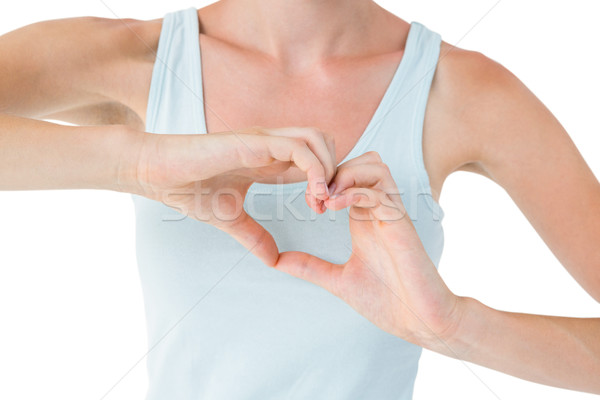 S'adapter femme forme de coeur mains blanche Photo stock © wavebreak_media