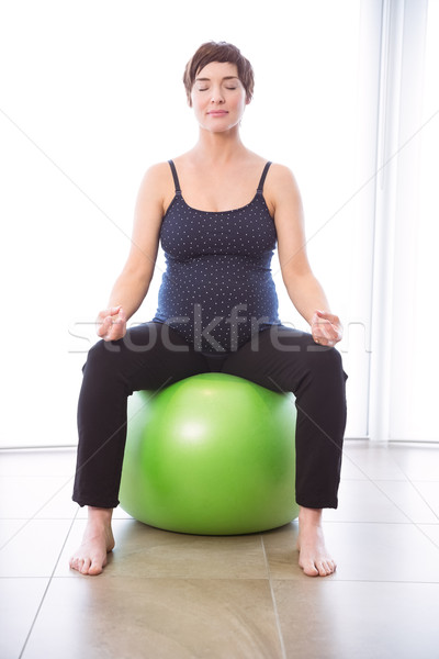 Stock photo: Pregnant woman keeping in shape