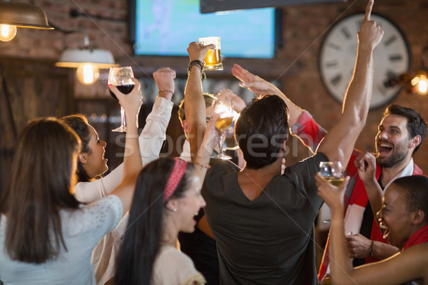 Friends enjoying in pub Stock photo © wavebreak_media