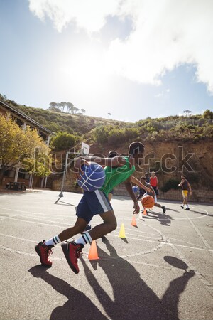 Fit woman climbing a rope during obstacle course training Stock photo © wavebreak_media