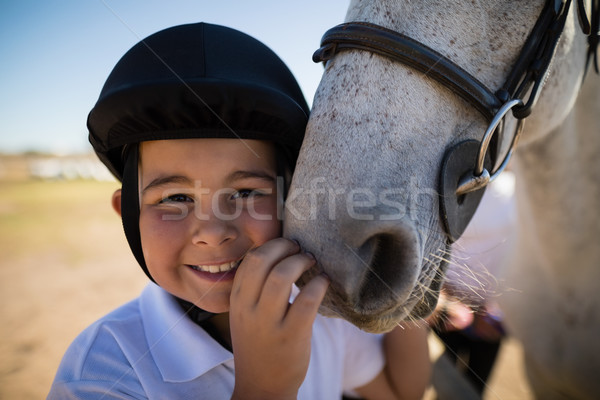 Sorridere ragazzo toccare cavallo bianco ritratto amore Foto d'archivio © wavebreak_media