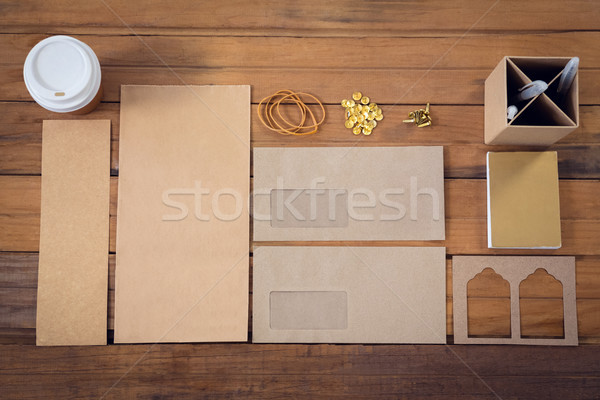 High angle view of office supplies with cardboard on table Stock photo © wavebreak_media