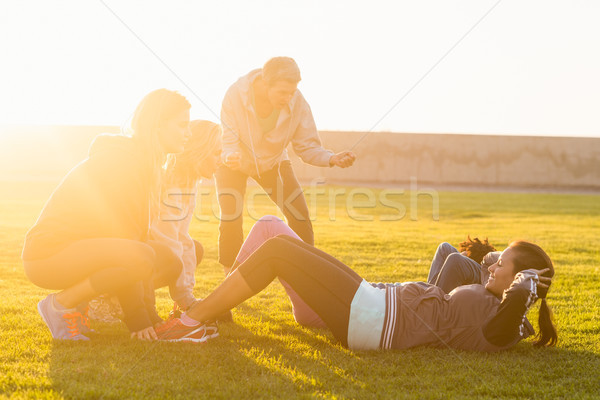 Sporty women doing sit ups during fitness class Stock photo © wavebreak_media