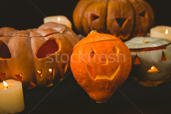 Close up of illuminated jack o lanterns with candles Stock photo © wavebreak_media