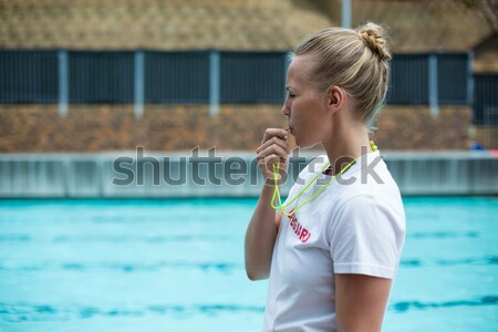 Beautiful blonde in the pool Stock photo © wavebreak_media